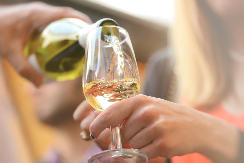 Glass of white wine being poured at Triple Creek Winery and other great wineries in MAryland