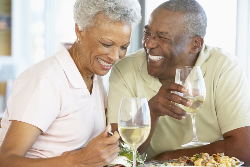 Middle aged black couple drinking wine at Triple Creek Winery and other great wineries in Maryland